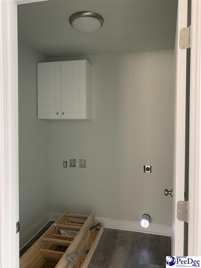 laundry room featuring cabinets, dark hardwood / wood-style floors, hookup for a washing machine, and hookup for an electric dryer