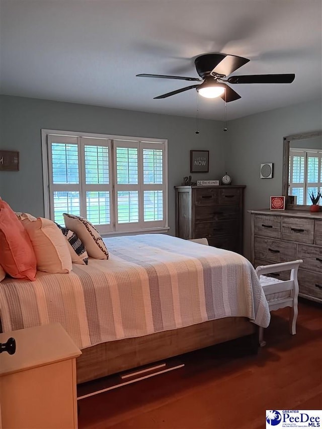 bedroom featuring hardwood / wood-style flooring and ceiling fan