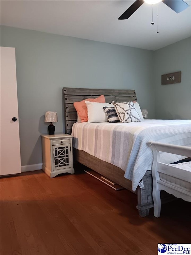 bedroom featuring ceiling fan and wood-type flooring