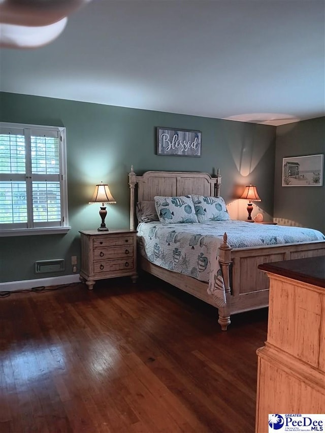 bedroom featuring dark hardwood / wood-style flooring