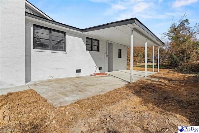 rear view of house featuring a patio