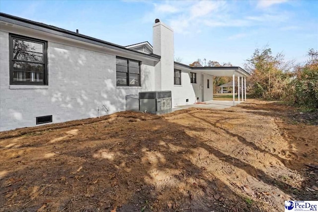 view of side of home with cooling unit