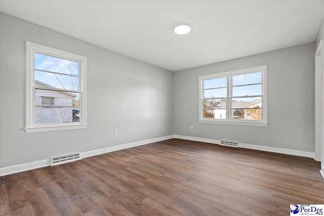 empty room featuring hardwood / wood-style flooring