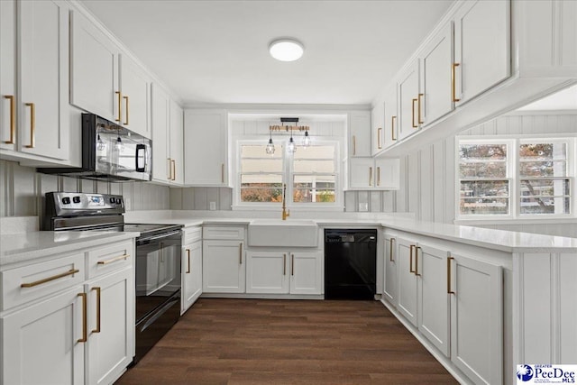 kitchen with white cabinets, a healthy amount of sunlight, sink, and black appliances