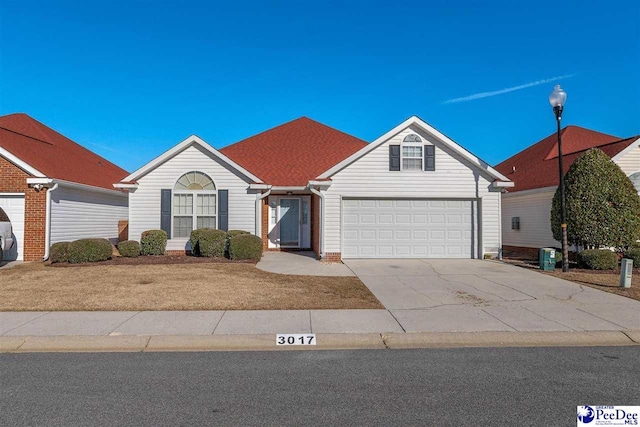 single story home featuring a garage and central air condition unit