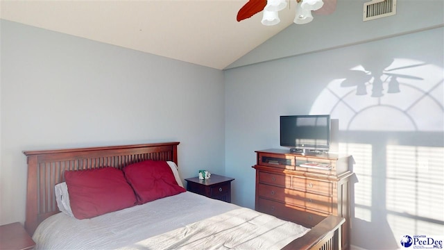 bedroom with visible vents, ceiling fan, and vaulted ceiling