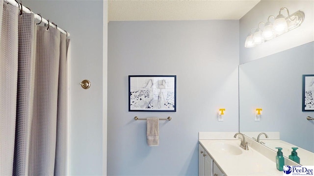 full bathroom featuring vanity and a shower with shower curtain
