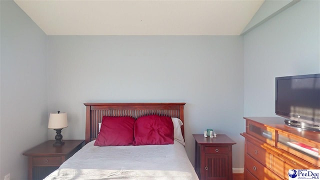 bedroom with vaulted ceiling