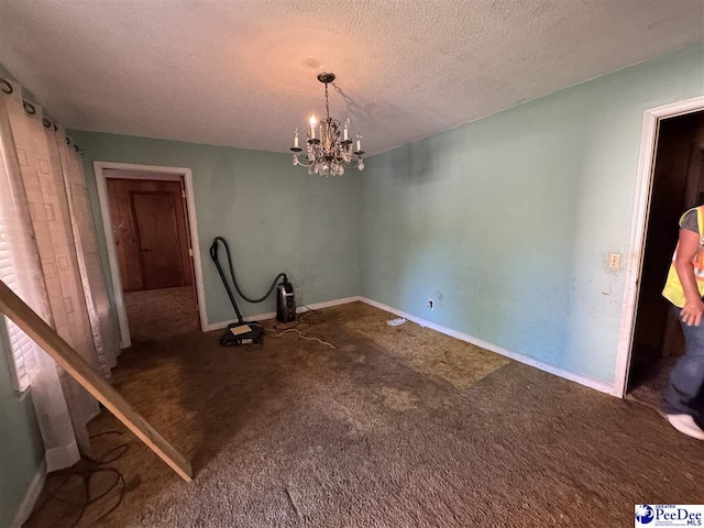 803 Pearl St, Darlington, SC 29532 - unfurnished dining area featuring a notable chandelier, a textured ceiling, carpet flooring, and baseboards