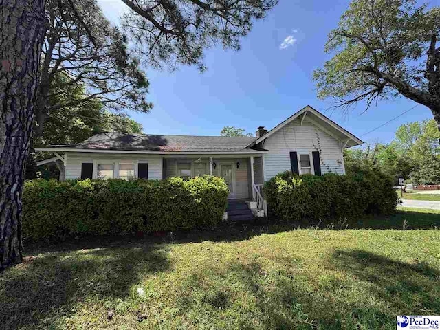 803 Pearl St, Darlington, SC 29532 - single story home featuring a front lawn and a chimney