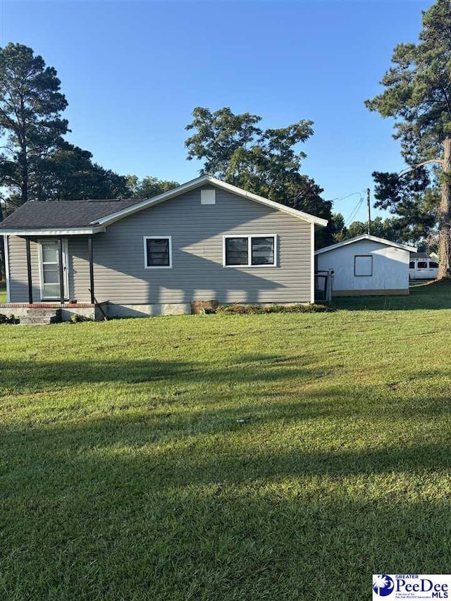 view of home's exterior with a yard