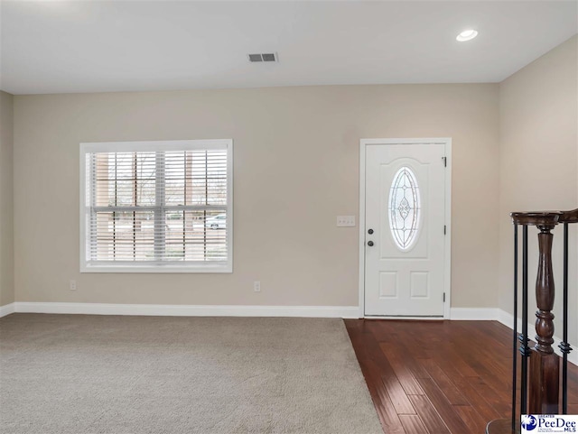 entryway with dark wood-type flooring