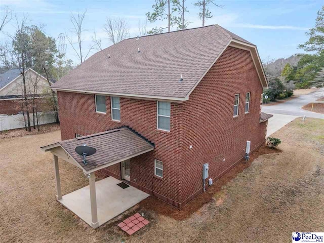 rear view of property featuring a patio