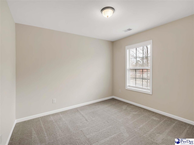 view of carpeted spare room