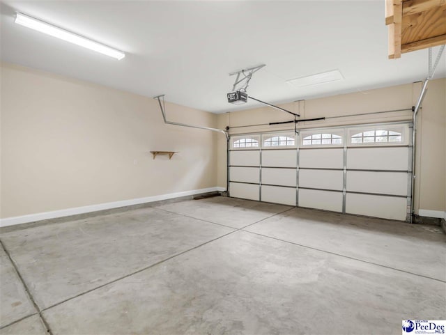 garage featuring a garage door opener