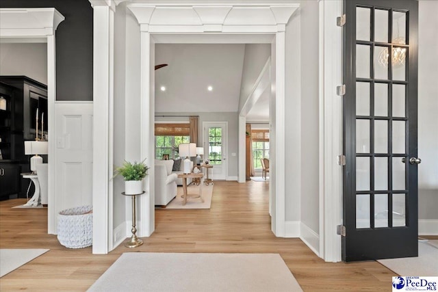 interior space featuring baseboards and wood finished floors