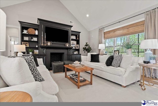 living room with high vaulted ceiling, a fireplace, and visible vents