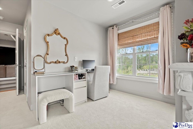 office space with light colored carpet and visible vents