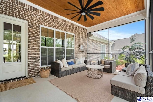 sunroom / solarium featuring an outdoor living space and a ceiling fan