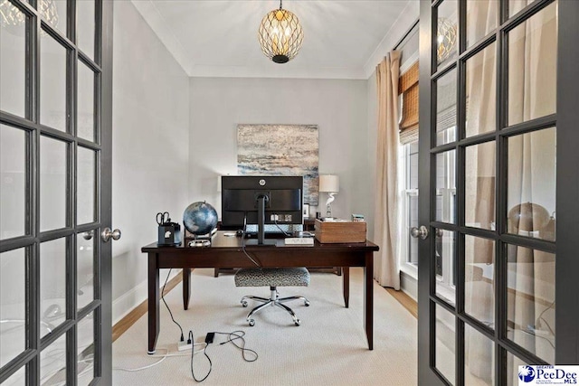 office space with baseboards, ornamental molding, french doors, and an inviting chandelier