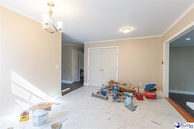 interior space with hardwood / wood-style flooring, crown molding, an inviting chandelier, and a closet