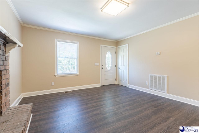 foyer with dark wood-type flooring and ornamental molding