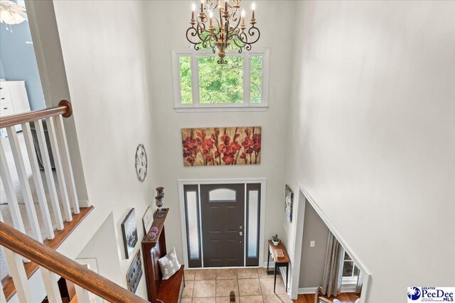 3250 Hampton Pointe Dr, Florence, SC 29501 - foyer entrance featuring a chandelier, a towering ceiling, and stairway