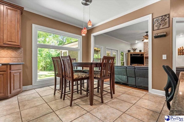 3250 Hampton Pointe Dr, Florence, SC 29501 - dining space with a ceiling fan, ornamental molding, light tile patterned floors, and baseboards
