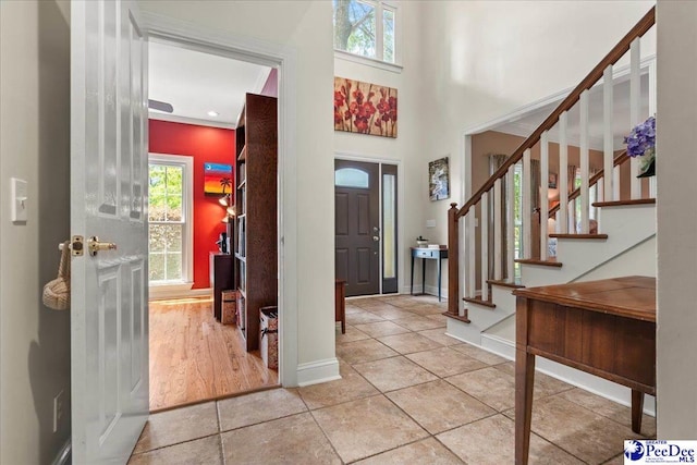 3250 Hampton Pointe Dr, Florence, SC 29501 - entrance foyer featuring healthy amount of natural light, stairs, baseboards, and light tile patterned flooring