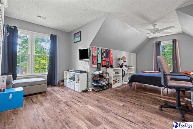 3250 Hampton Pointe Dr, Florence, SC 29501 - bedroom with a textured ceiling, wood finished floors, lofted ceiling, and ceiling fan