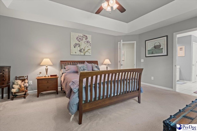 3250 Hampton Pointe Dr, Florence, SC 29501 - carpeted bedroom featuring baseboards, ensuite bath, a raised ceiling, and a ceiling fan