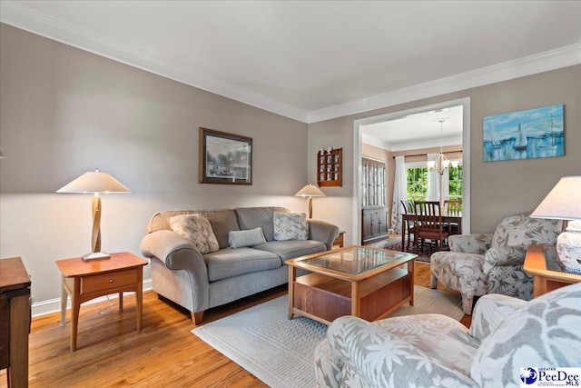 3250 Hampton Pointe Dr, Florence, SC 29501 - living area featuring light wood finished floors, ornamental molding, a chandelier, and baseboards