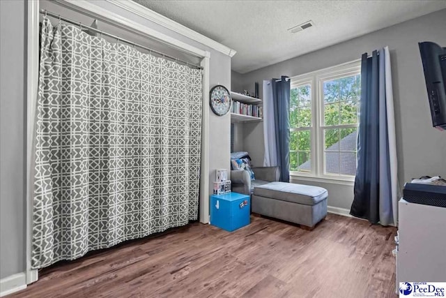 3250 Hampton Pointe Dr, Florence, SC 29501 - bedroom with wood finished floors and a textured ceiling