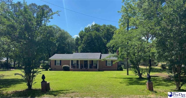 109 Tec Rd, Cheraw, SC 29520 - single story home featuring a front yard and a sunroom