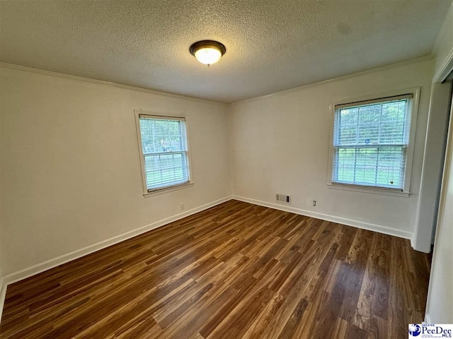 109 Tec Rd, Cheraw, SC 29520 - spare room with crown molding, a textured ceiling, and dark wood-style flooring