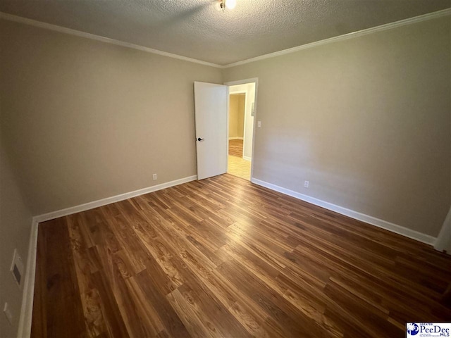 109 Tec Rd, Cheraw, SC 29520 - empty room with dark wood finished floors, a textured ceiling, and crown molding