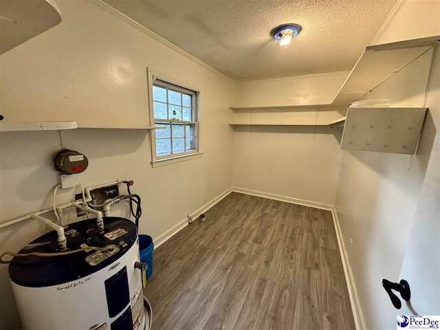 109 Tec Rd, Cheraw, SC 29520 - washroom with electric water heater, a textured ceiling, wood finished floors, and ornamental molding
