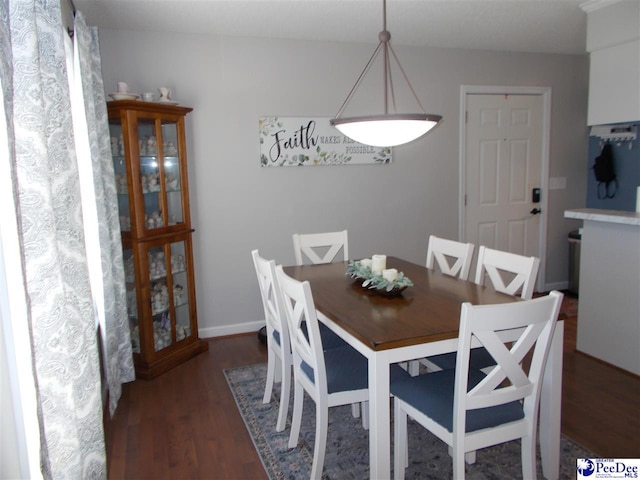 dining room with dark hardwood / wood-style flooring