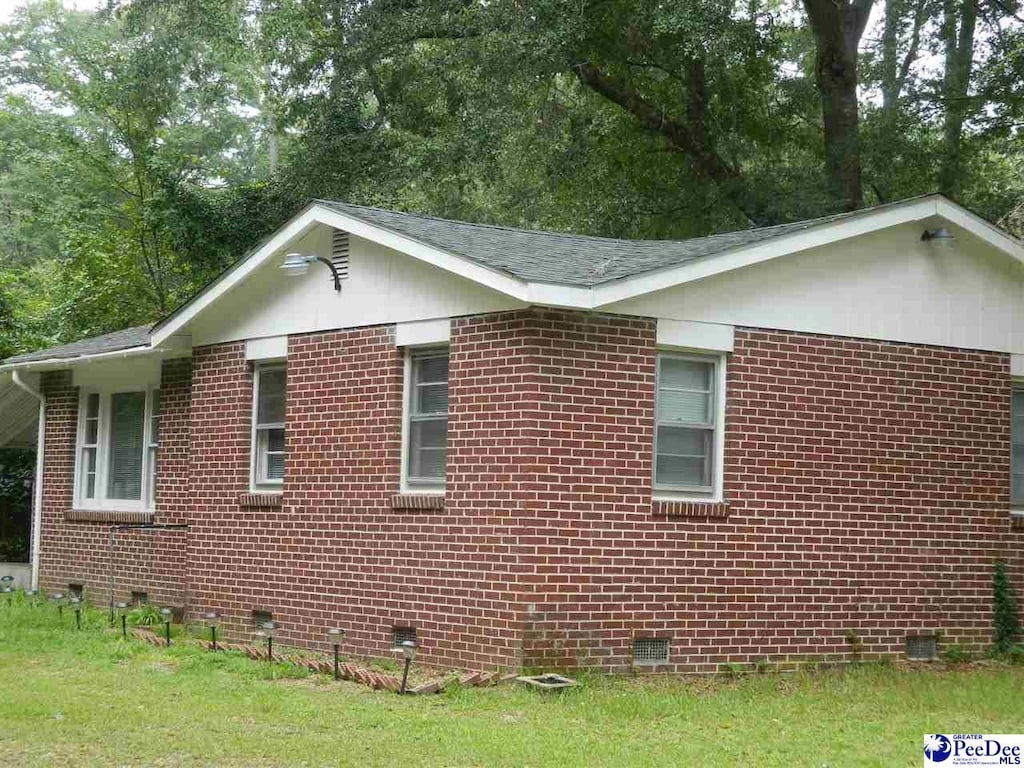 view of home's exterior featuring a lawn