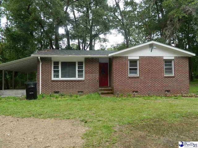 view of front of home featuring a carport and a front yard