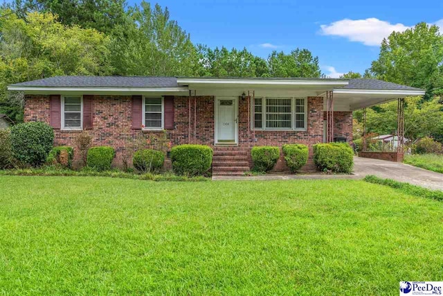 single story home featuring a front yard and a carport