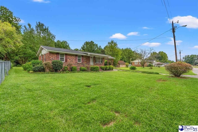 ranch-style home with a front lawn