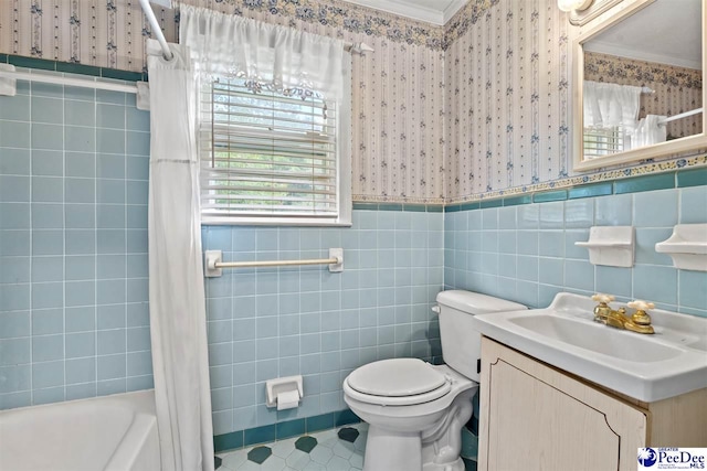 full bathroom featuring shower / bathtub combination with curtain, crown molding, vanity, tile patterned floors, and toilet