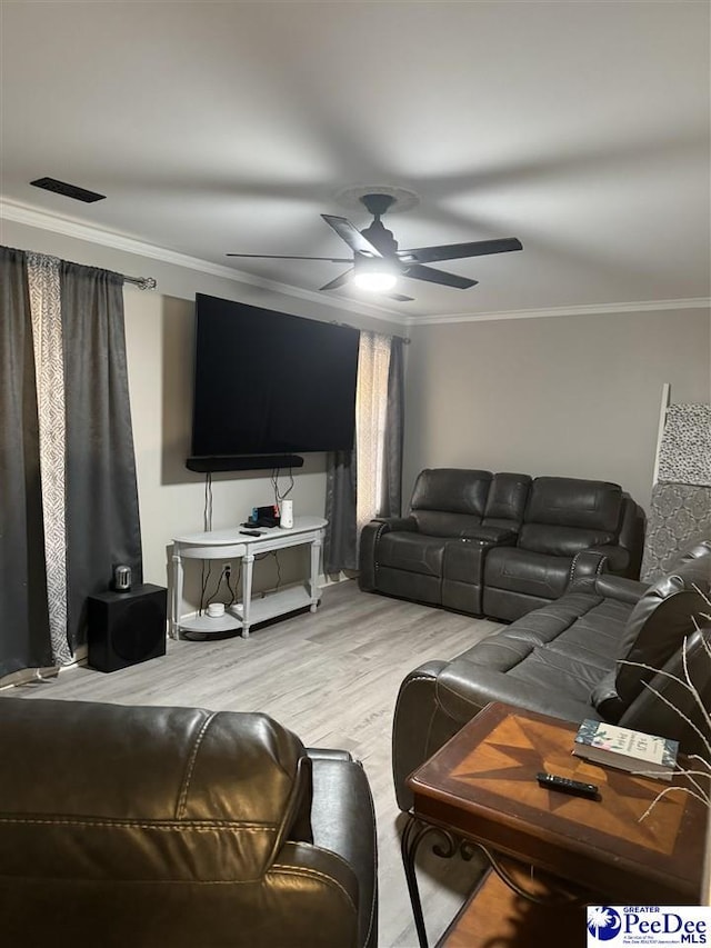 living room featuring ornamental molding, hardwood / wood-style floors, and ceiling fan