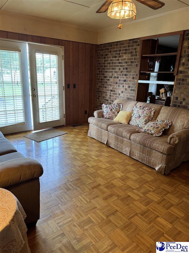1816 Southern Acres Loop, Dillon, SC 29536 - living area with a ceiling fan, ornamental molding, and wooden walls