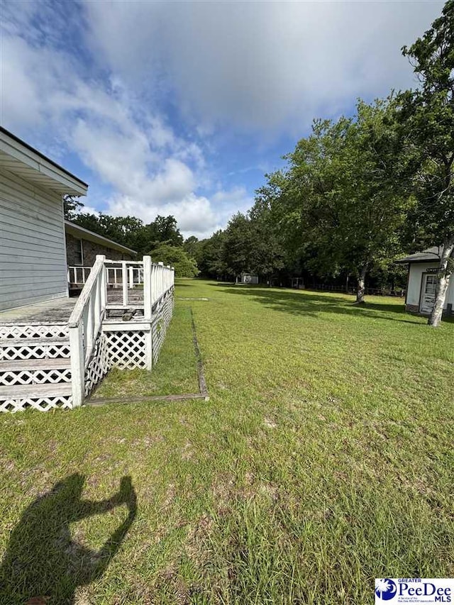 1816 Southern Acres Loop, Dillon, SC 29536 - view of grassy yard featuring a wooden deck