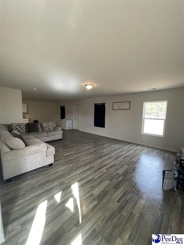 living room with dark hardwood / wood-style floors