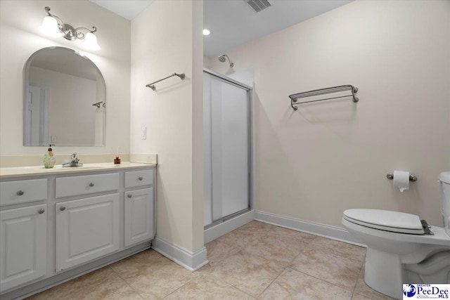 bathroom with an enclosed shower, vanity, tile patterned floors, and toilet