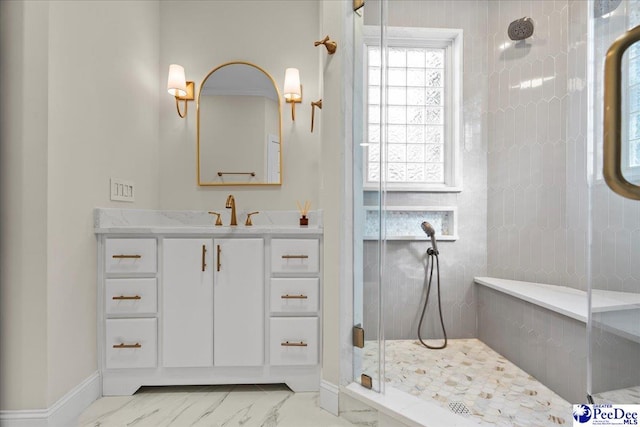 bathroom with vanity and an enclosed shower