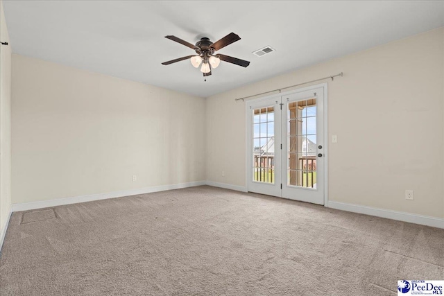 1635 Lake Wateree Dr, Florence, SC 29501 - carpeted empty room with baseboards, a ceiling fan, and visible vents